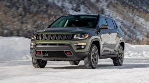 Green Jeep Compass on Snow