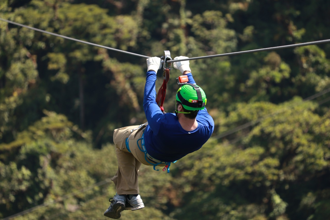 A man ziplining somewhere