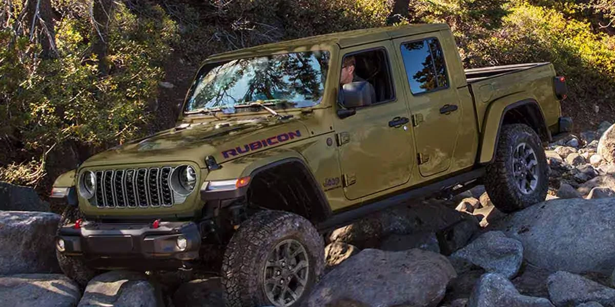 Jeep Gladiator Rubicon navigating rocky terrain, illustrating Jeep Gladiator service tips for off-road performance and maintenance.
